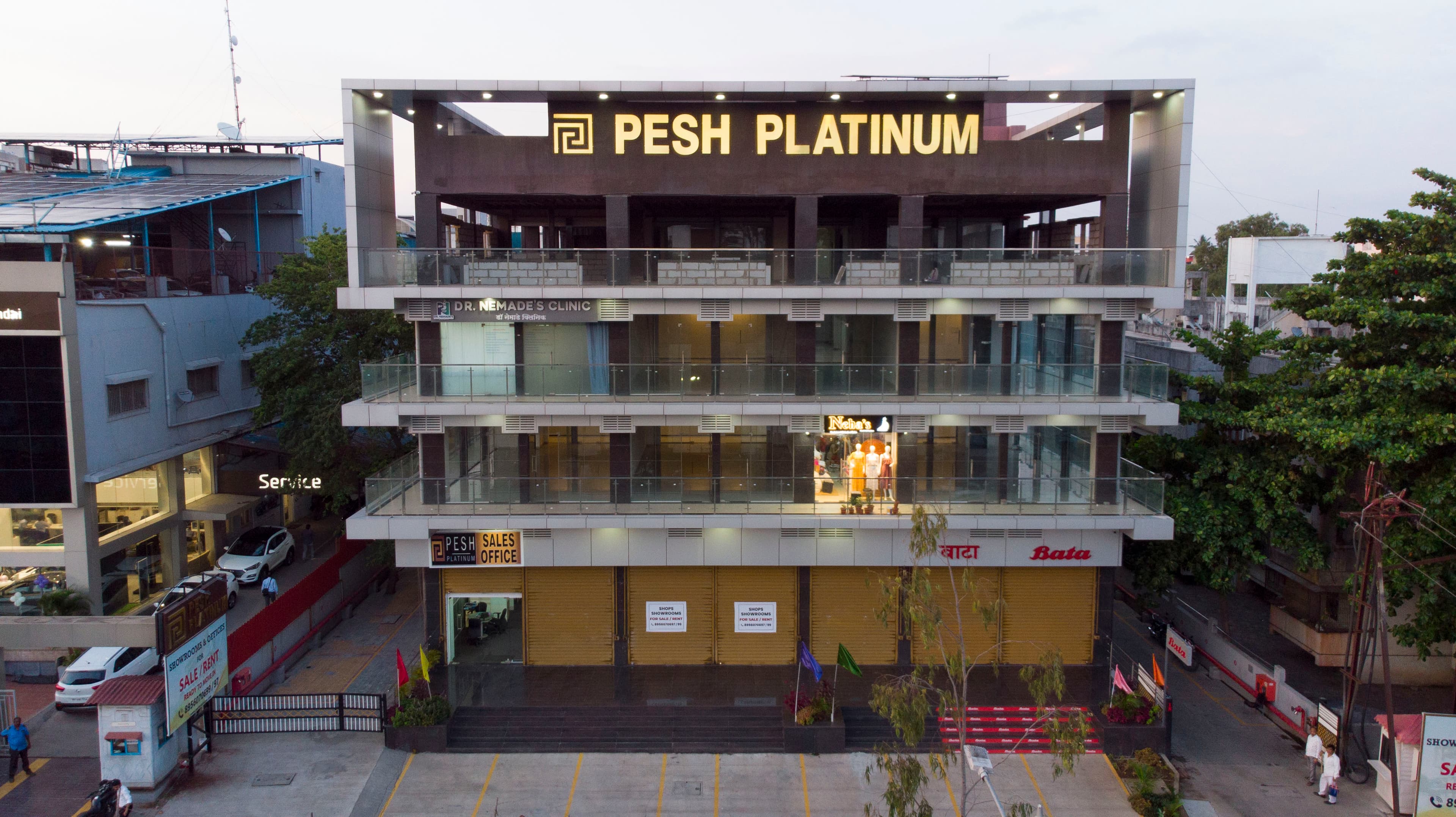Pesh Platinum commercial property at dusk, Thermax Chowk, Chinchwad