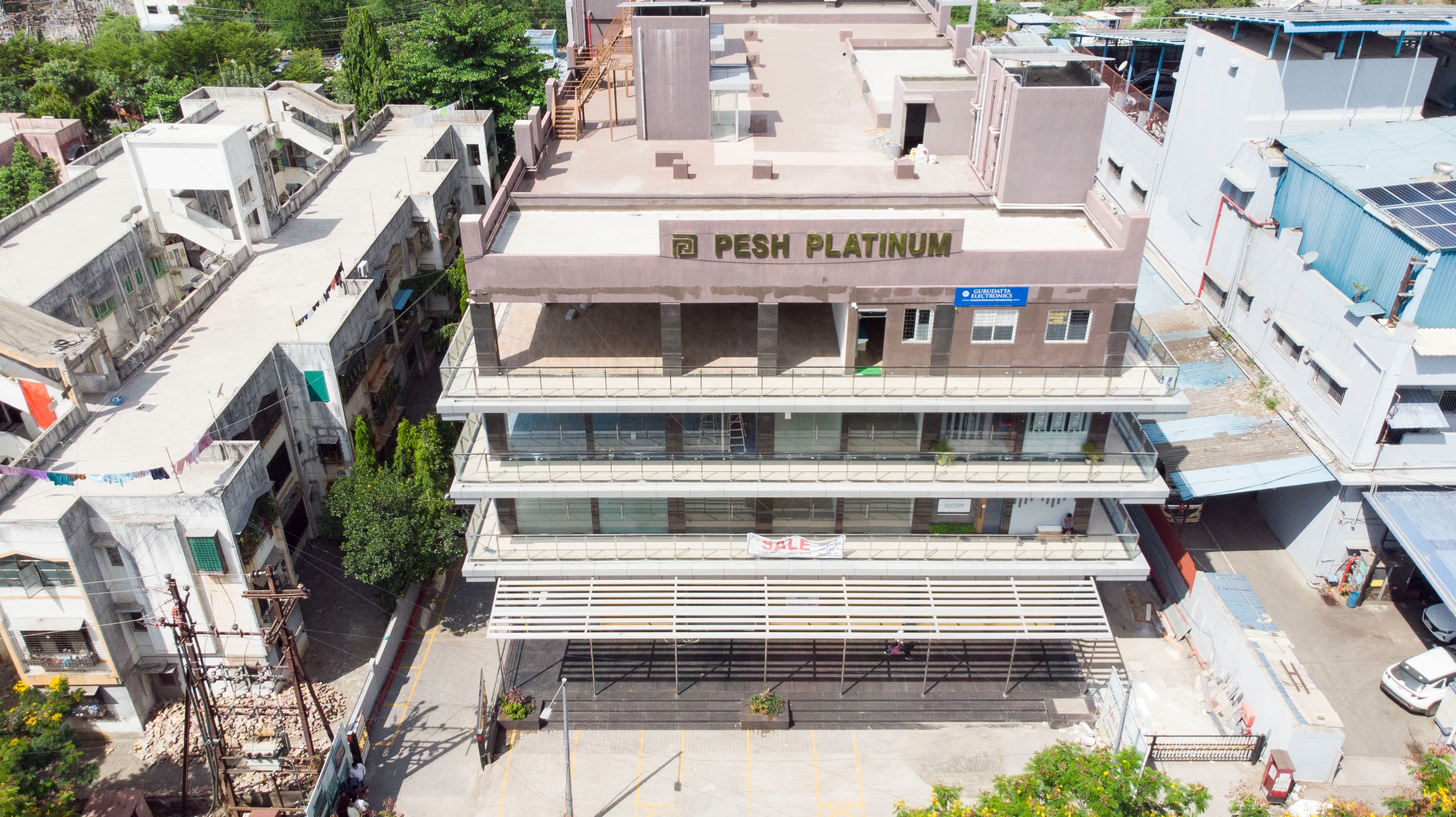Close aerial view of Pesh Platinum rooftop and upper floors